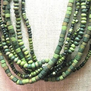 Layered Bohemian style necklace with several strands of mixed length beads